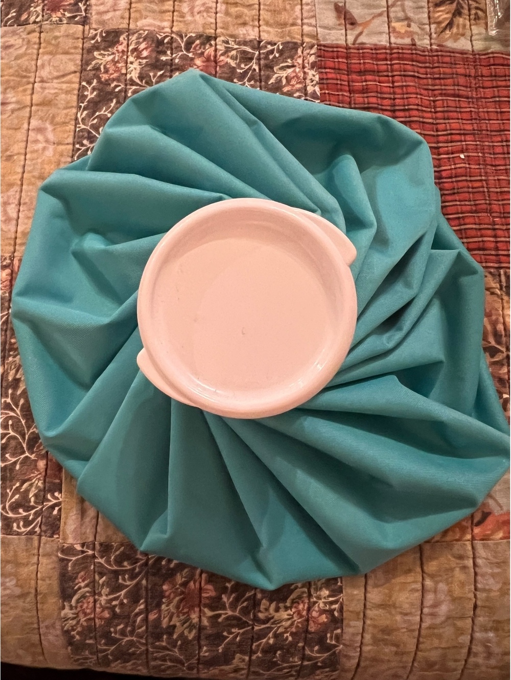 Blue ice bag with white screw cap
